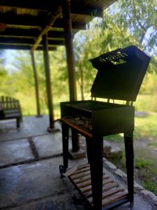 a barbecue grill with a box on top of it at Complejo La Cascada San Javier in San Javier