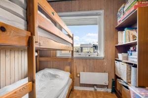 a small room with bunk beds and a window at 40322-Juelsminde-Frede-Juels-vej-261 in Sønderby +19 photos