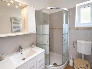 a bathroom with a shower and a sink at Koko's home in Ston +21 photos