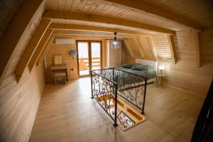 an overhead view of a bedroom in a wooden house at Bungalow&Spa GIGIC I - Whirpool in Brčko