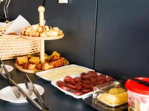 a table with a tray of food and other foods at Bella Vista Hotel in Barreirinhas +12 photos