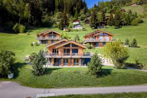 an aerial view of a large house on a hill at Chalet Aramis in Riddes