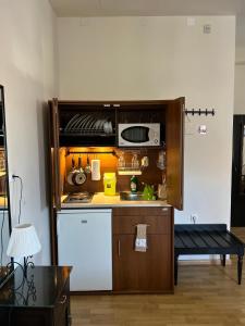 a kitchen with a sink and a microwave at Archontiko Tsikari in Város