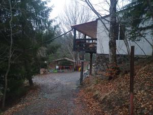 a building on the side of a dirt road at Nautic Colibița in Colibiţa