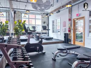 a gym with a bunch of exercise bikes in it at The Stallion #305 - Walk to Attractions - Modern Spacious 1BD Loft in Memphis Downtown in Memphis