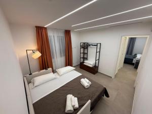 a bedroom with a bed with two towels on it at Villa Heaven Sperlonga in Itri +112 photos