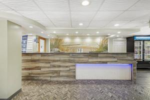 a lobby of a store with a stone wall at Best Western Plus Chesapeake Bay-Norfolk in Norfolk +64 photos