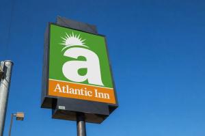 a sign for an atlantic firm on a pole at Atlantic Inn Marshalltown, Iowa in Marshalltown