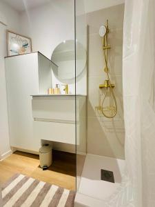 a bathroom with a shower with a glass door at Aytré plage in Aytré