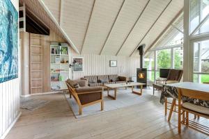 a living room filled with furniture and a fireplace at FY244-Assens-Osterbakken-3 in Assens