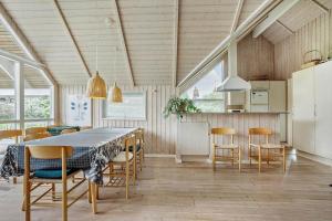 a kitchen and dining room with a table and chairs at FY244-Assens-Osterbakken-3 in Assens