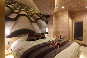 Ένα ή περισσότερα κρεβάτια σε δωμάτιο στο ホテル ゼン町田