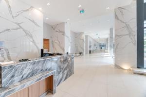 a lobby of a building with a marble counter at Waterfront Luxury Condo in Toronto