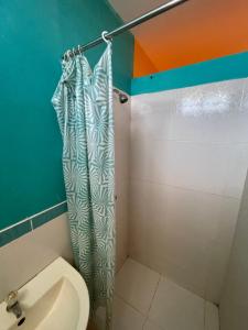 a bathroom with a toilet and a shower at Pacasmagic Surf&Kite in Pacasmayo