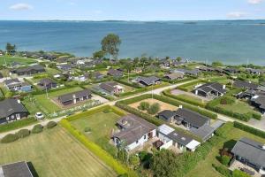 an aerial view of a house with the ocean in the background at FY267-Faaborg-Horsehoved-37 in Faaborg