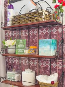 a shelf with toiletries and other items on it at Ataco Cabin Views Breakfast and Coffee in Tacuba +47 photos