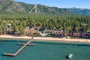 an aerial view of a resort on a beach at Beautiful Condo with private beach access & shared pools in South Lake Tahoe
