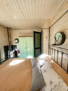 a room with a bed with pillows on it at Isla Chaná Private Hideaway in Buenos Aires