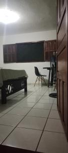 a classroom with a bed and a desk and a chair at Pilatos in Ocosingo +1 photo
