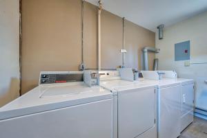 a laundry room with washers and dryers at A Western Rose in Cody +119 photos