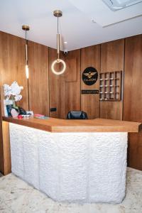 a bar in a restaurant with wooden walls at Hotel Falcon in Žabljak