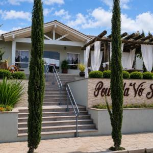 a house with trees in front of it at Pousada Vó Santina in Protásio Alves