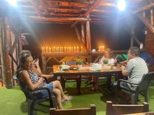 a group of people sitting at a table at Chiki luki in Playa Blanca