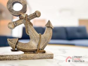 a metal statue of a boat on a table at Beachfront pool whirlpool & firepit in Montañita