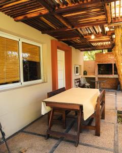 a dining room with a table and a patio at Canto a Jujuy - Yala in Yala +13 photos