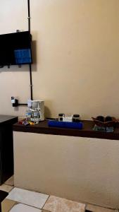 a desk with a computer on top of it at Loft Industrial con fogatero in Mineral del Monte +11 photos