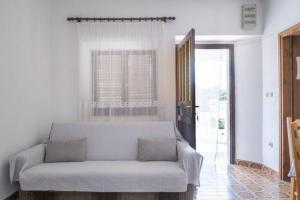a living room with a couch and a window at Apartments by the sea Grscica, Korcula - 4487 in Prizba