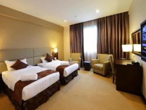 Ένα ή περισσότερα κρεβάτια σε δωμάτιο στο Lintas View Hotel