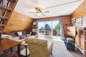 a living room with a couch and a table at Chalet #25 in Stevensville