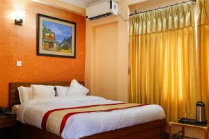 Voodi või voodid majutusasutuse Kathmandu Garden Home toas