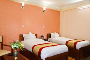Voodi või voodid majutusasutuse Kathmandu Garden Home toas