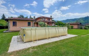 a pool in a yard in front of a house at Casa Giovanni in Camaiore