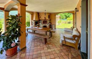 a living room with a table and a fireplace at Casa Giovanni in Camaiore +21 photos