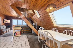 a dining room with a table and chairs at Chalet #18 in Stevensville