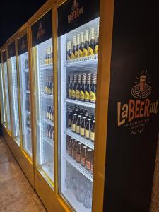 a refrigerator filled with lots of bottles of beer at Hotel Zagreb in Crikvenica