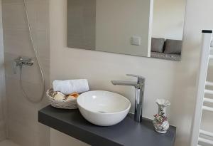 a bathroom with a bowl sink on a counter at Aldea de Rosalía in Padrón +12 photos