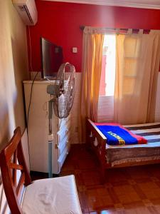a room with a fan next to a window at Quintacolastinenorte in Santa Fe