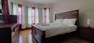 a bedroom with a large bed and a television at Eagle's Hub Niagara ny in Niagara Falls