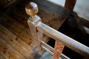 a metal rail on a wooden stair case at Omoya Kitahata in Karatsu +28 photos