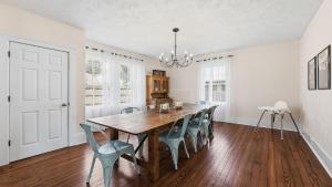 a dining room with a wooden table and chairs at Brevard Bliss in Brevard +24 photos