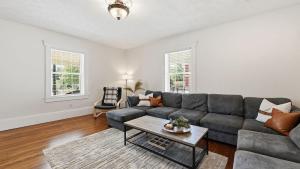 a living room with a couch and a table at Brevard Bliss in Brevard