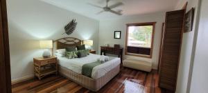 a bedroom with a bed and a window at South Pacific Resort & Spa Noosa in Noosaville +125 photos