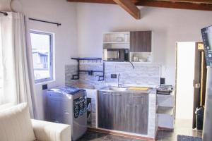 a kitchen with a sink and a counter top at Aparta estudio in Itagüí