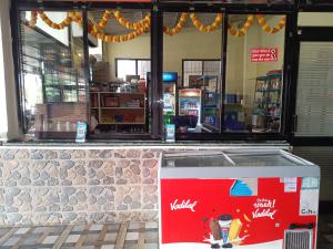 a view of a store front with avertisement for at Natraj hotel rooms and restaurant in Motīnāla