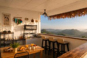 a restaurant with a table and chairs and a view at THỎ NON GARDEN CLOUDY OCEAN VIEW in Blao Srê +15 photos