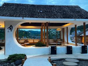 a building with a view of a city at Wojia我家 in Ban Rak Thai +22 photos